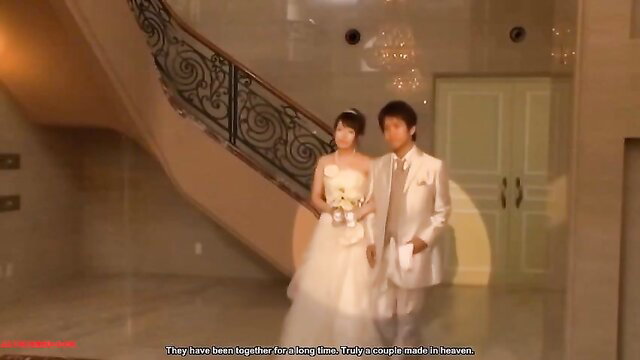 Azumi Mizushima in elegant white wedding dress and groom suit