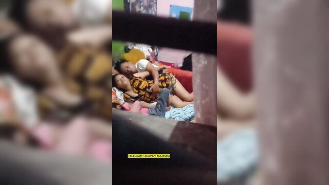 Amateur Indonesian couple fucking next to sleeping child caught on cam