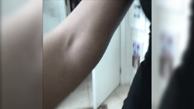 Shay Evans closeup arm and blurred indoor tease
