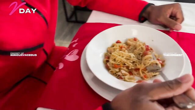 Mimi Curvaceous eating pasta in red Valentine's Day outfit