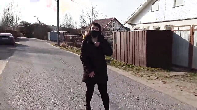 Shameless wife in coat and mask walks boldly on public street