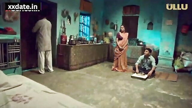 Desi Bhabhi in saree with young guy sitting on floor in hot Indian scene