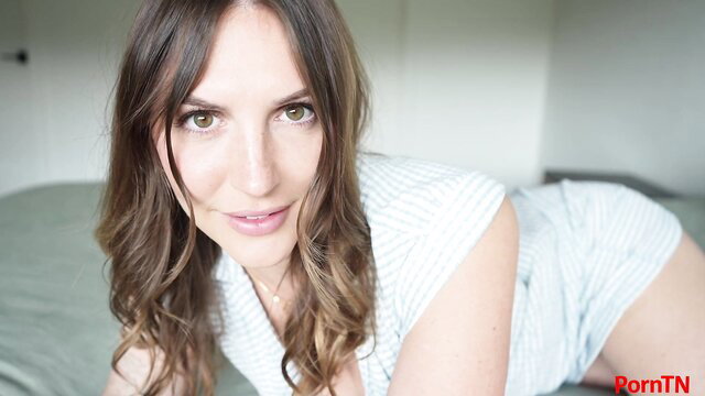 Tatum Christine in tight striped top and shorts, seductive pose on bed