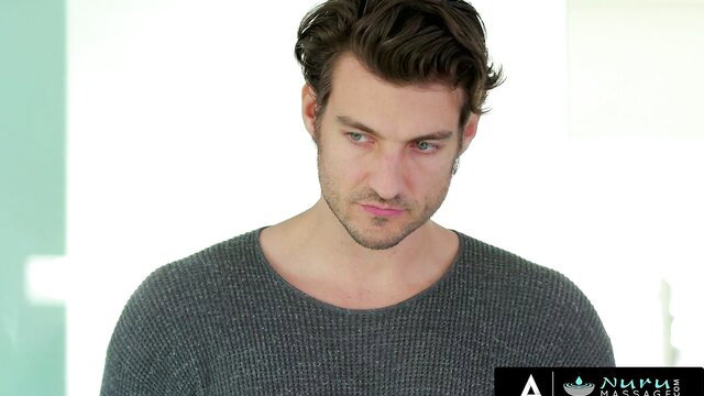 Handsome male client in gray sweater for Kendra Spade Nuru Massage