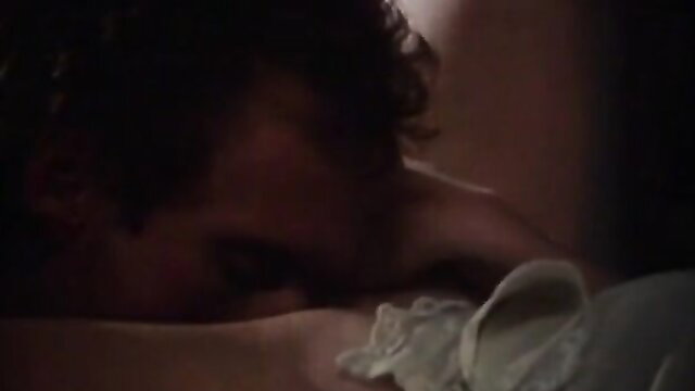 Vintage 1981 porn thumbnail: man passionately kissing woman's neck in bed