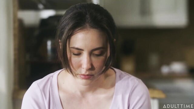 Pregnant Casey Calvert in pink top, thoughtful closeup