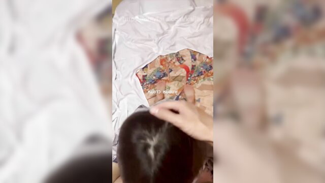 Asian OnlyFans model Kaijeaw topless in floral shirt on bed