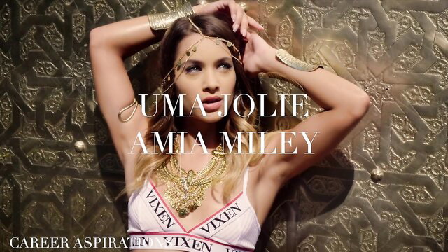 Blonde Vixen Angel Uma Jolies poses sexy in gold jewelry & lingerie