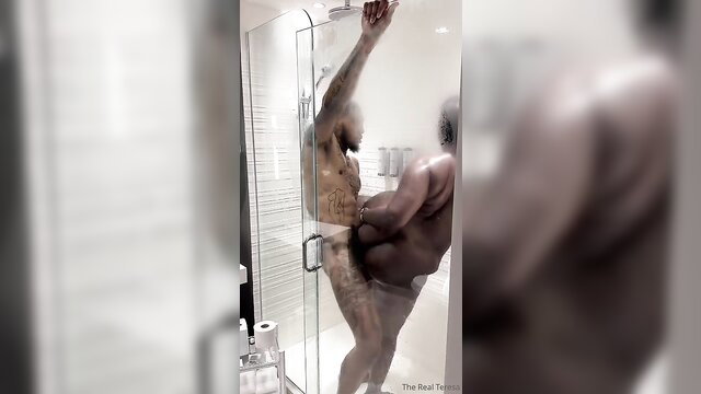Two muscular black men showering nude together, explicit gay thumbnail
