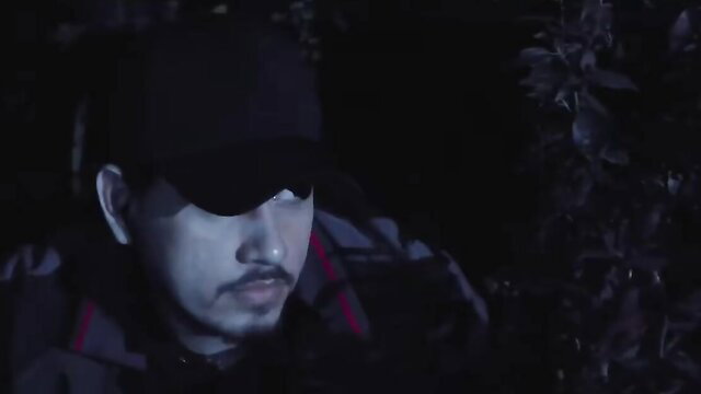 Mystery Asian man in black cap and jacket lurking in dark bushes, Vivamax thriller vibe