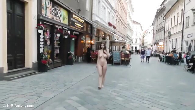 Stella Cox walks completely naked in public street, nude exhibitionist