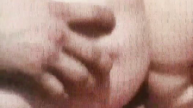 Closeup of woman's glossy lips and chin in vintage Sleazy Rider porn