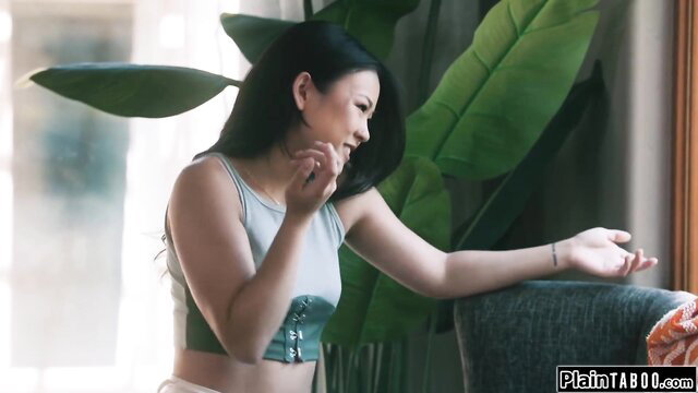 Lulu Chu in sexy tank top and corset, seductive pose