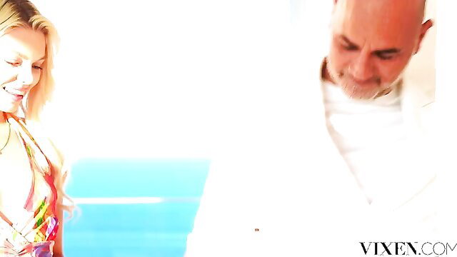 Kelly Collins sexy blonde in bikini with man, Vixen poolside tease