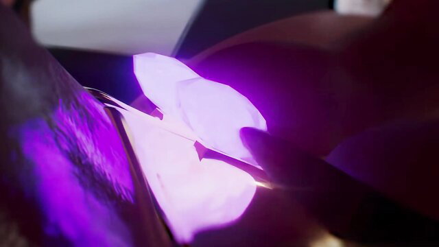 Woman worships glowing 3D monster cocks under purple light