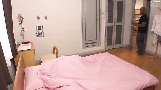 Lala Kudo pinned on bed by black man in JAV homestay scene