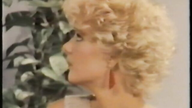 Blonde big-haired retro pornstar profile closeup, 1980s style
