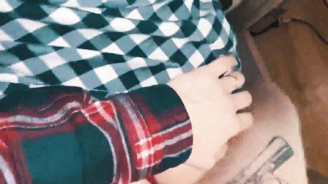 Step-sis in plaid shirt shows tattooed hand near gun tattoo on thigh