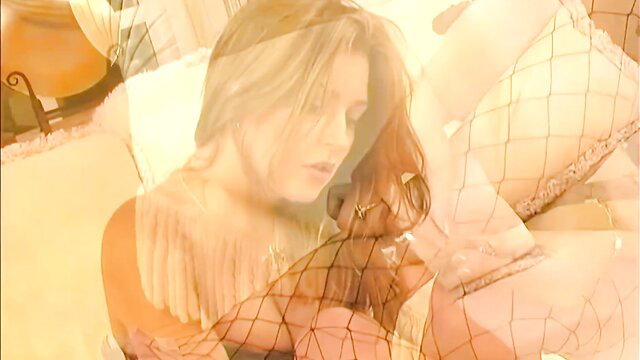 Avy Scott beautiful blonde in fishnet lingerie on bed