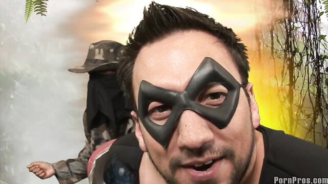 Deadpool-masked man in jungle with masked buddy, outdoor adventure tease