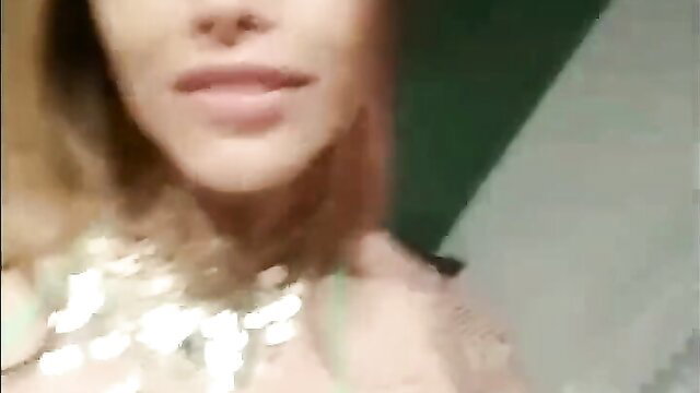 Closeup of hot shemale's glossy lips and gold necklace in bareback teaser