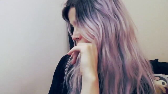 Arya Jolie thoughtful pose with pastel purple hair on MFC
