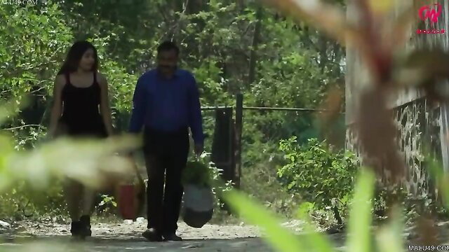 Indian big boobs bhabhi in black top walks with older man outdoors