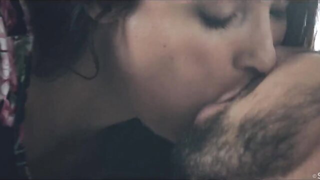 Anissa Kate passionately kissing bearded man in erotic French couple scene