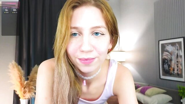 Niko_tine blonde webcam girl smiling in tank top closeup