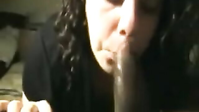 Curly-haired ebony babe eagerly deepthroats big black cock closeup