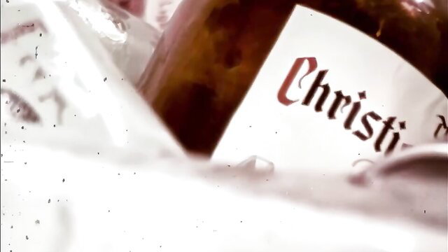 Closeup of vintage Christin jar label in erotic vignette lighting