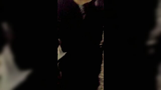 Curvy brunette in black dress teases with cleavage and sideboob