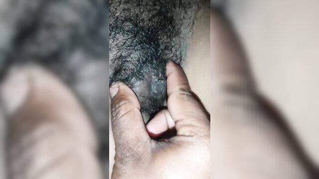 Closeup of dark hairy pussy fingered by hand in amateur desi bhabhi video