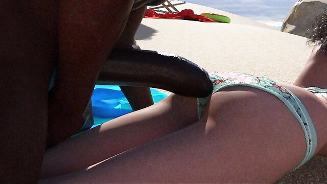 Bikini girl on nudist beach with huge BBC pressing against her ass