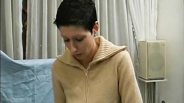 Hot German retro MILF with short black hair in cozy sweater, surprised look