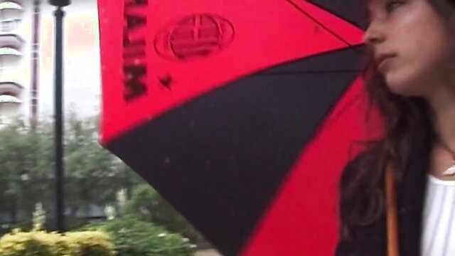 Asian amateur babe with red black umbrella in outdoor teaser
