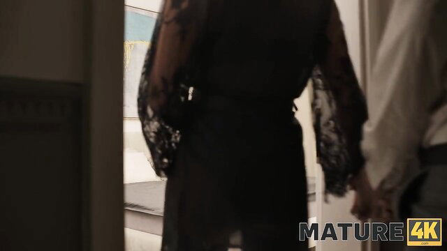 Alex Romero holds mature beauty in sexy black lace dress