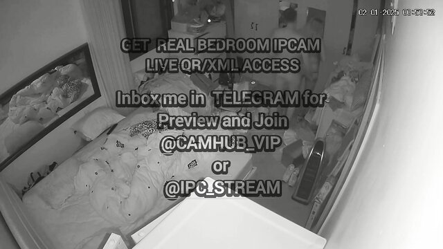 Blurry bedroom cam thumbnail with live access text overlay