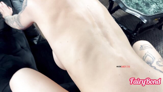 FairyBond nude back view tattooed model bent over sofa