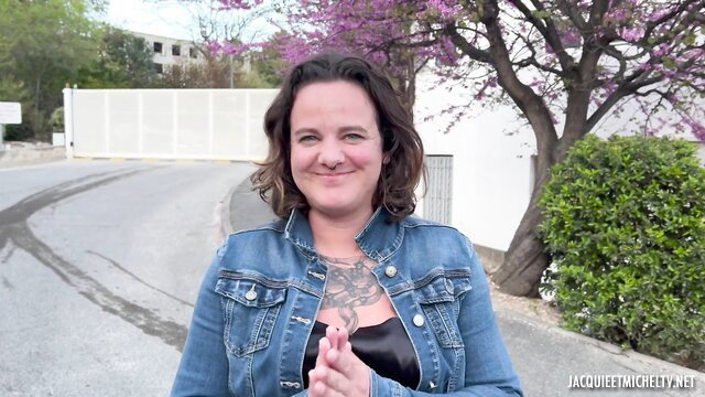 Angel Ray mature slut in jeans jacket, big tits tattoos outdoors