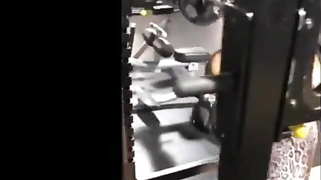 Ava Devine in tight leopard print workout gear on gym machine