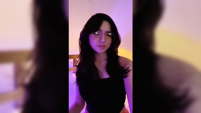Sexy Pinay with bangs and glasses in tight black top, teasing TikTok vibe