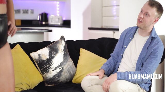 Hijab MILF tempts man on vacation in tight skirt, seductive sofa pose