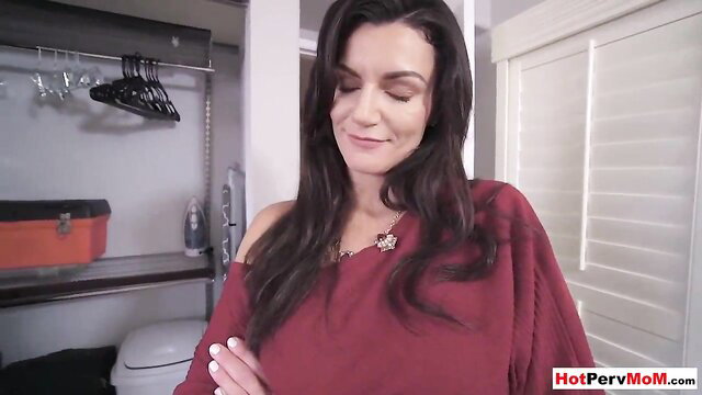 Big boobed brunette cougar stepmom in red top smiles seductively