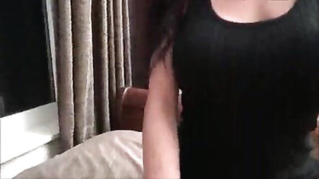 Brunette in tight black tank top teases cleavage in family therapy scene