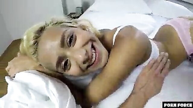 Blonde Colombian teen smiling in lingerie on bed, squirting orgasm