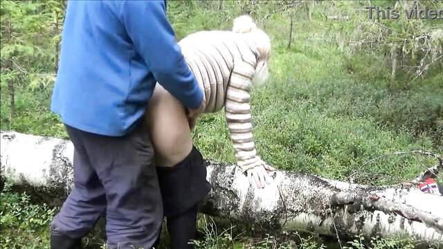 Blonde in sweater and stockings bent over log for outdoor forest sex