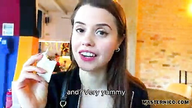 Cute brunette Jamie holds white snack, smiling seductively in Master Nico sex vlog