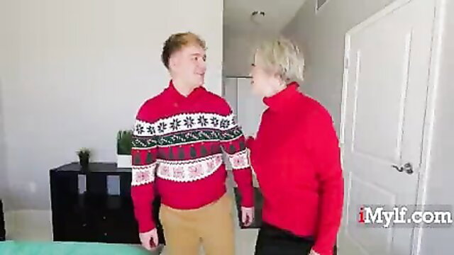 Dee Williams in red sweater with Joshua Lewis stepmom Christmas thumbnail