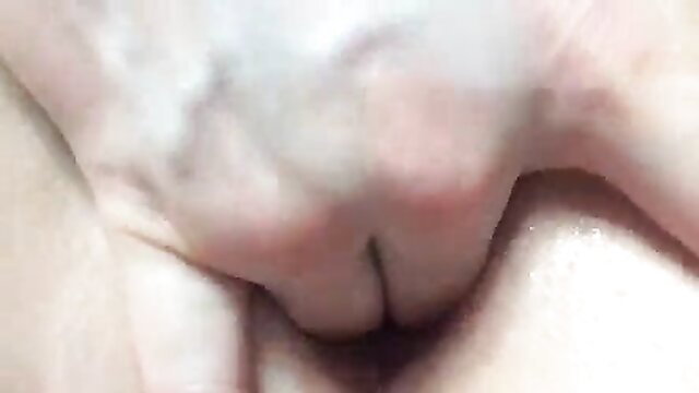 Closeup of pale girl's wet shaved pussy spread by fingers after orgasm